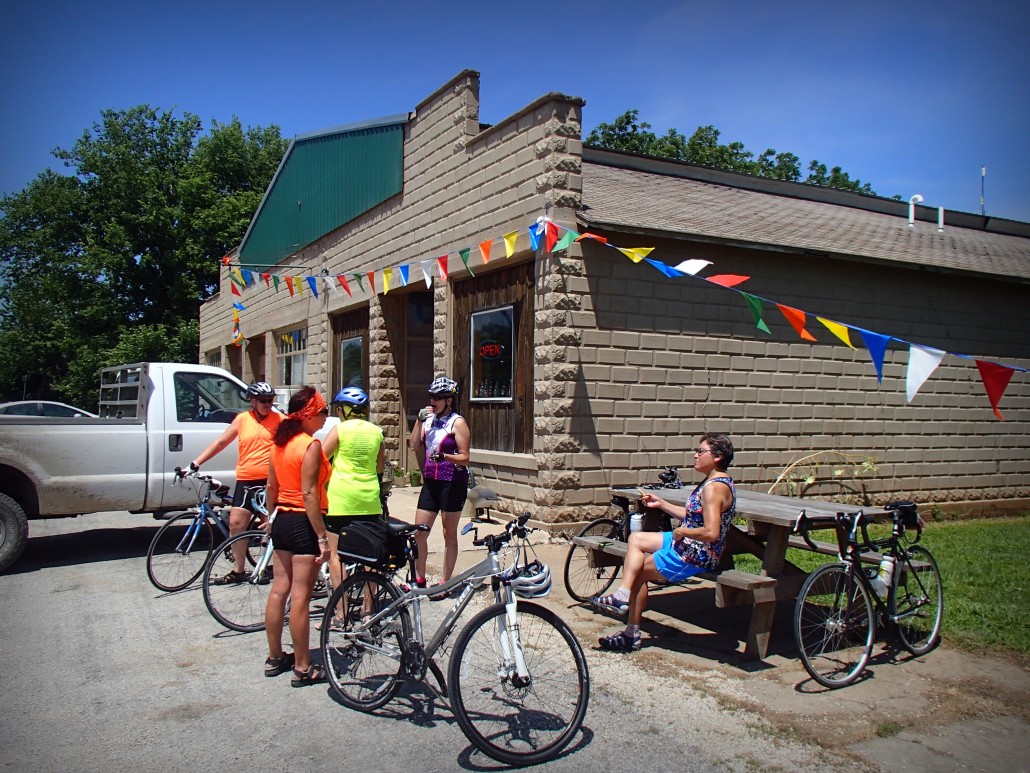 Bicyclists take a break at the Mildred Store in Mildred, Kansas.